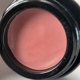 Open jar of OSHAN ACACIA Balm from above, showing the pink tint inside.