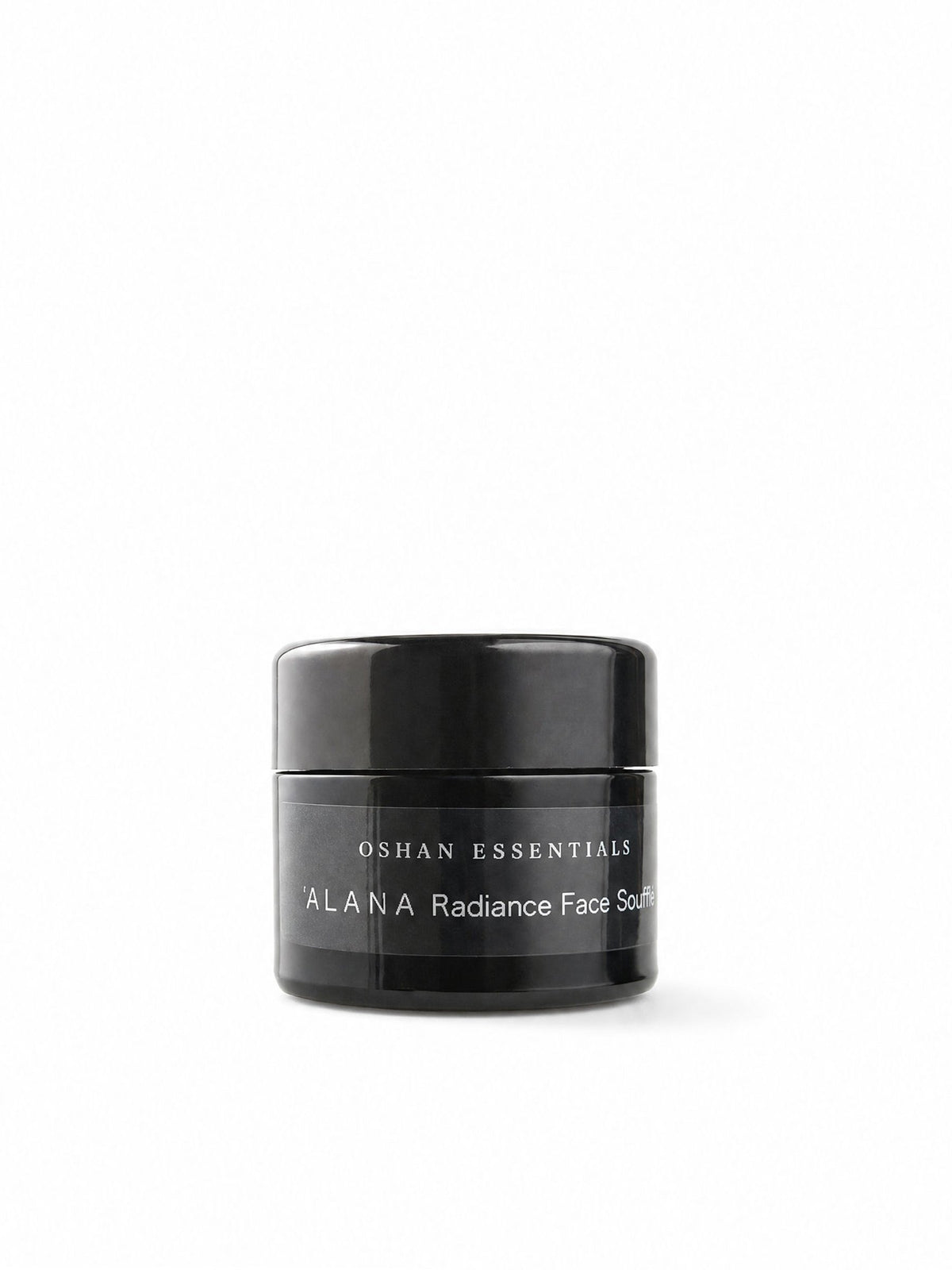 OSHAN ʻĀLANA Radiance Face Soufflé in its black jar on a white background.