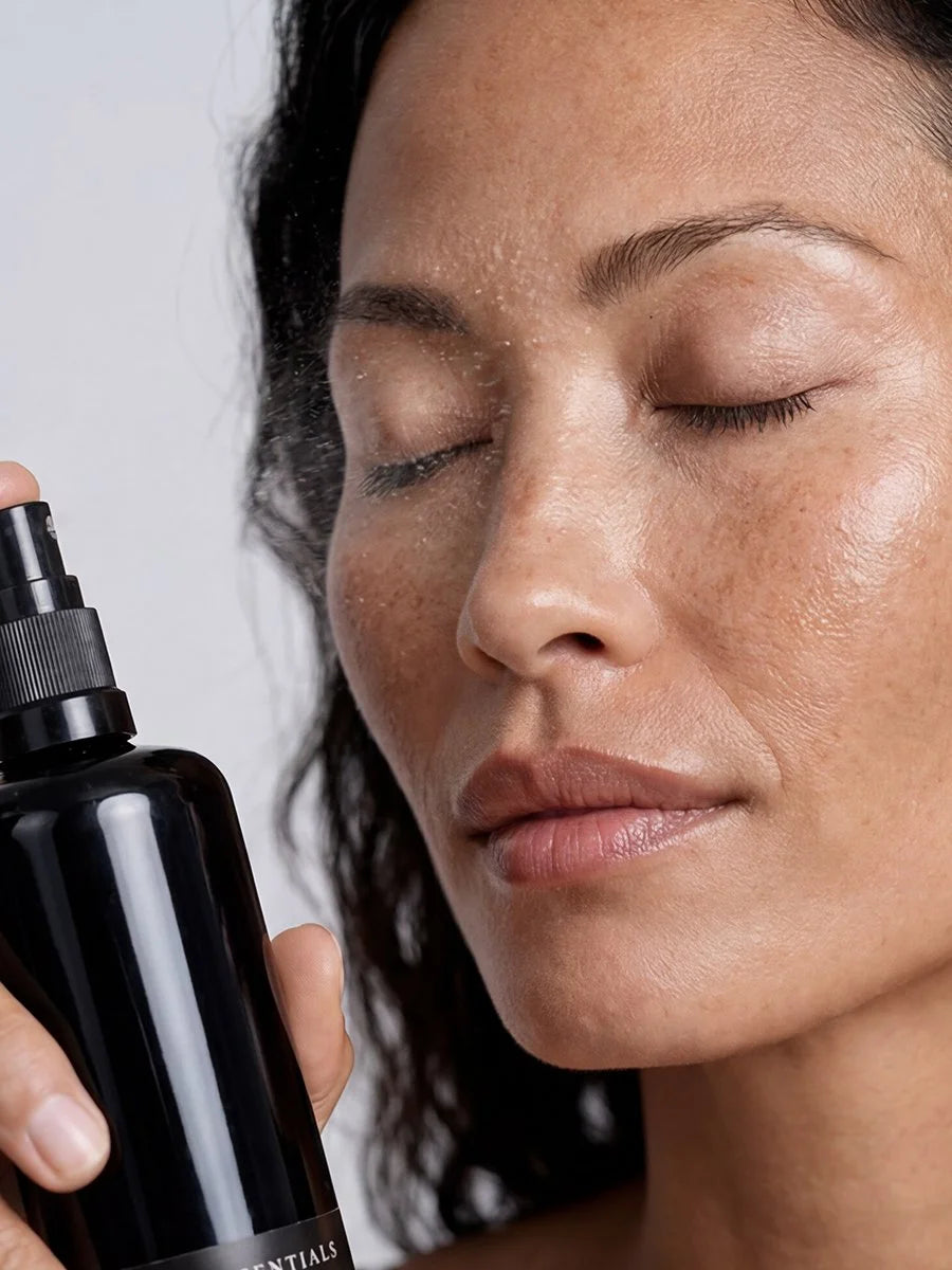 Model misting OSHAN ʻAWAPUHI Balancing Toner over her face, eyes closed.