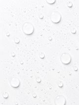 Clear droplets of OSHAN ʻAWAPUHI Balancing Toner across a white surface.