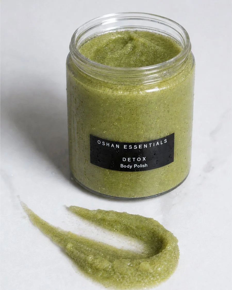 Full size OSHAN DETOX ʻŌMAʻOMAʻO Body Polish jar with a green scrub swatch beside it.