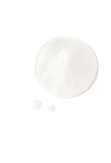 A clear droplet of OSHAN ʻĪLIAHI Hydration Mist on a white surface.