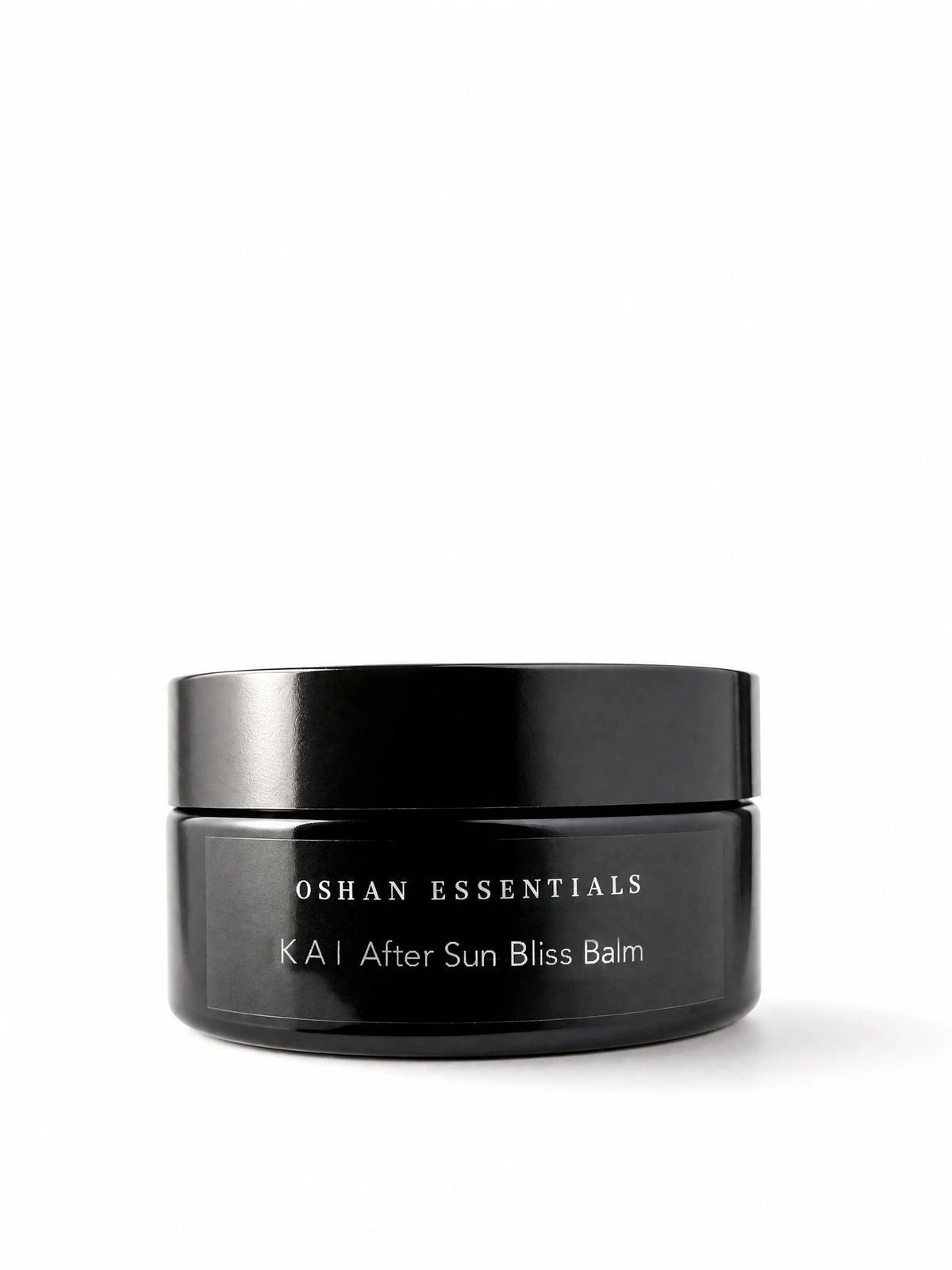OSHAN KAI After Sun Bliss Balm in its black jar on a white background.