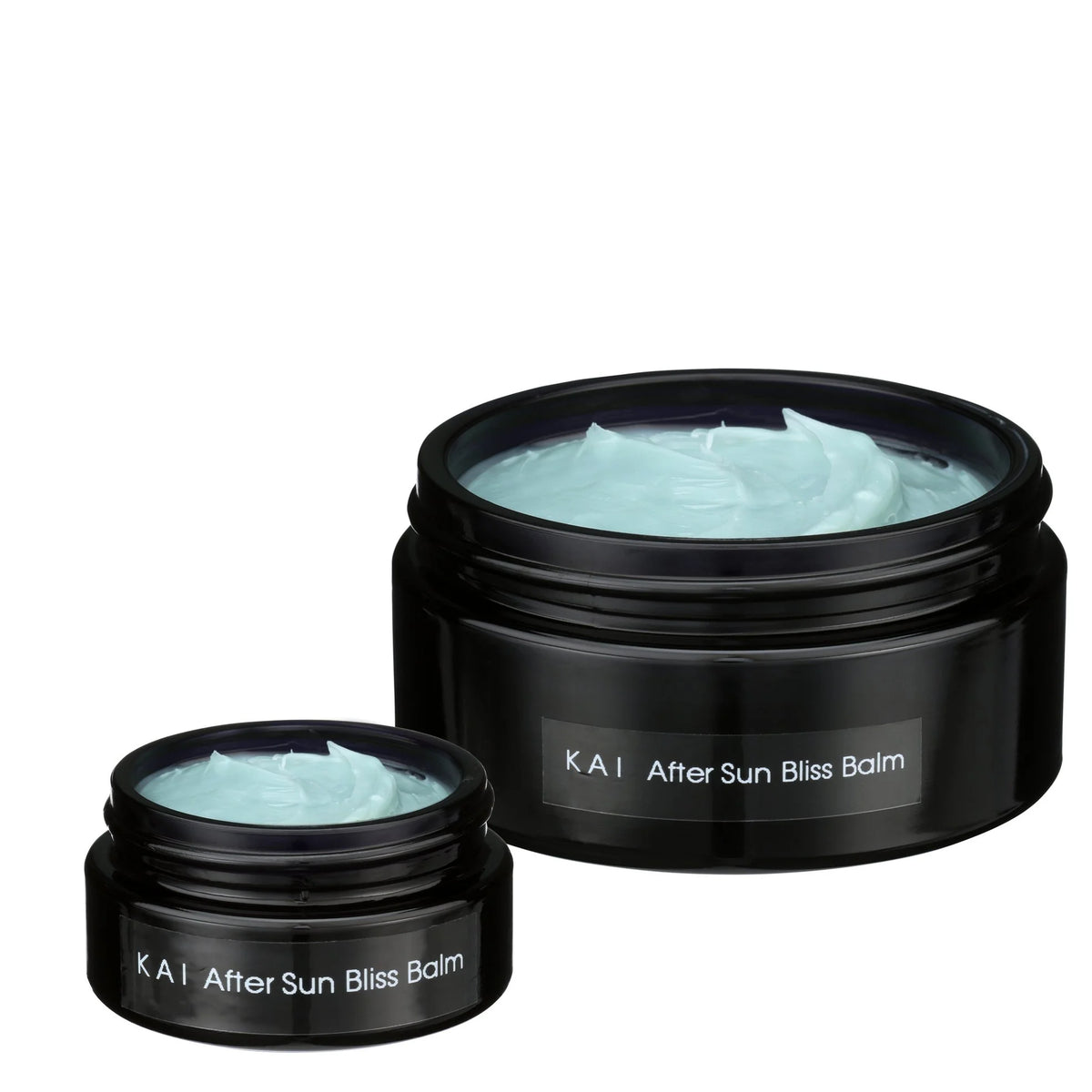 Travel and full size jars of OSHAN KAI After Sun Bliss Balm, both open.