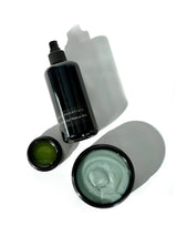 OSHAN KAI After Sun Rescue Milk bottle with two open after sun balm jars.