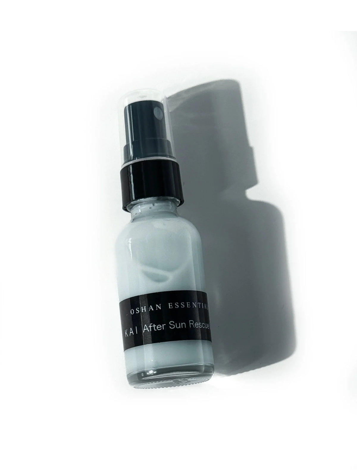 Travel size bottle of OSHAN KAI After Sun Rescue Milk on a pale background.