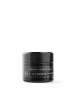 OSHAN KOKIʻO Hydrating Exfoliant in its black jar on a white background.