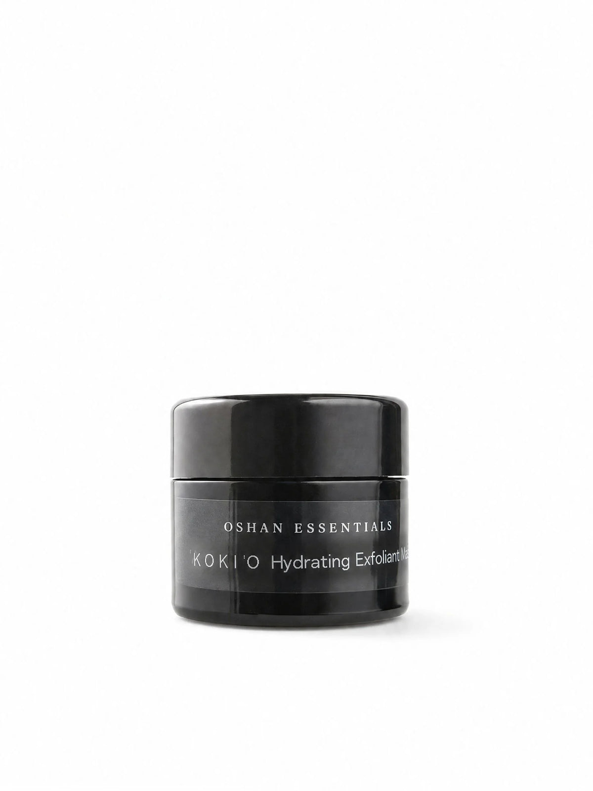 OSHAN KOKIʻO Hydrating Exfoliant in its black jar on a white background.
