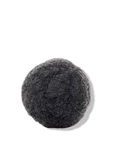 OSHAN KONJAC Sponge in charcoal grey on a white background.