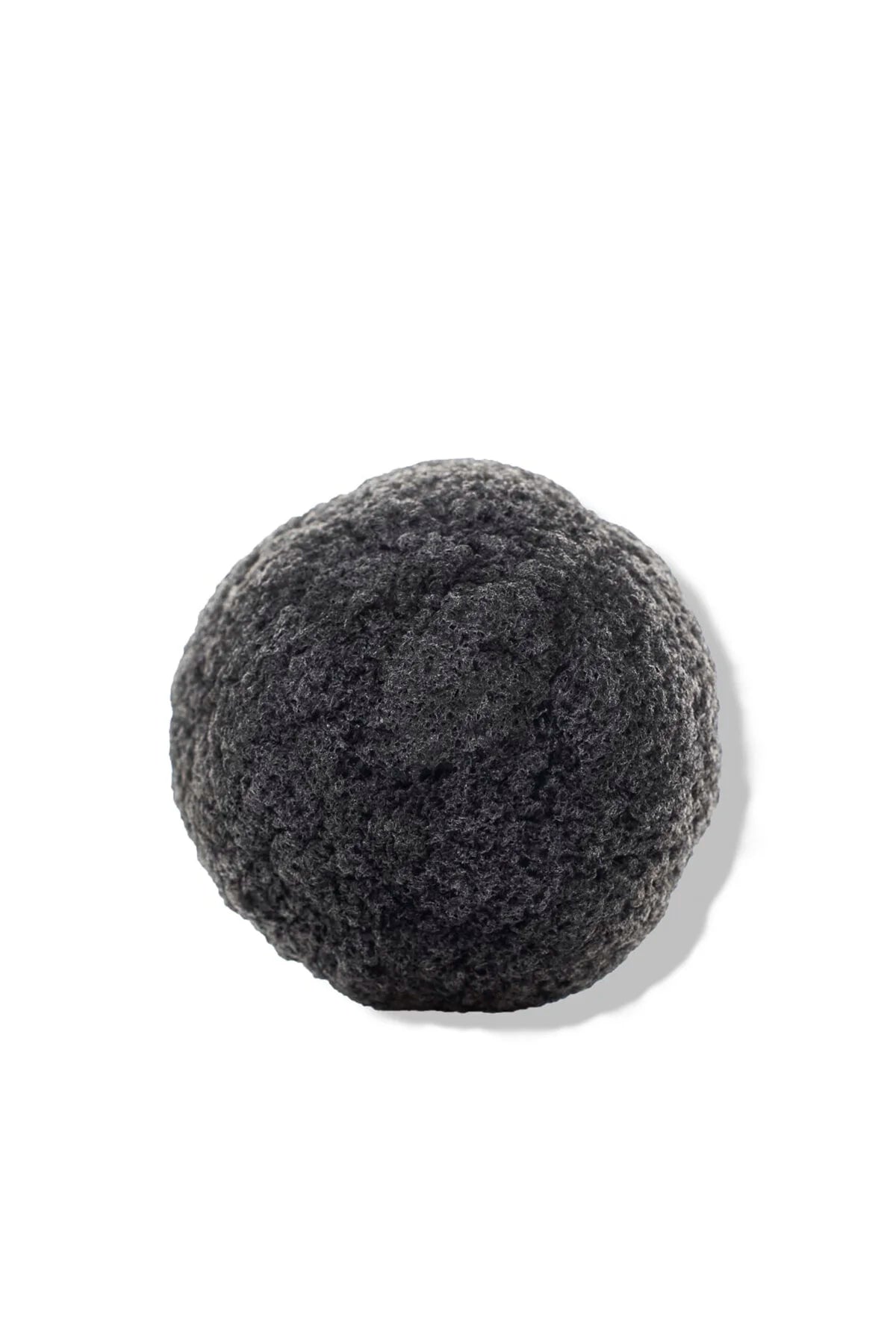 OSHAN KONJAC Sponge in charcoal grey on a white background.
