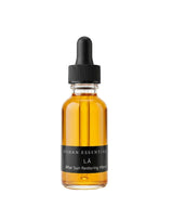OSHAN LĀ Soothing After Sun Manoʻi in its amber dropper bottle on white.