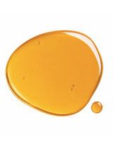 Texture swatch of the golden OSHAN LĀ Soothing After Sun Manoʻi oil.