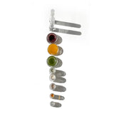 The ten trial sizes of the OSHAN Mini Facial Ritual Set laid out in a row.