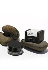 OSHAN MOHĀ Beautifying Concrete Gelée jar and box balanced on stacked river stones.