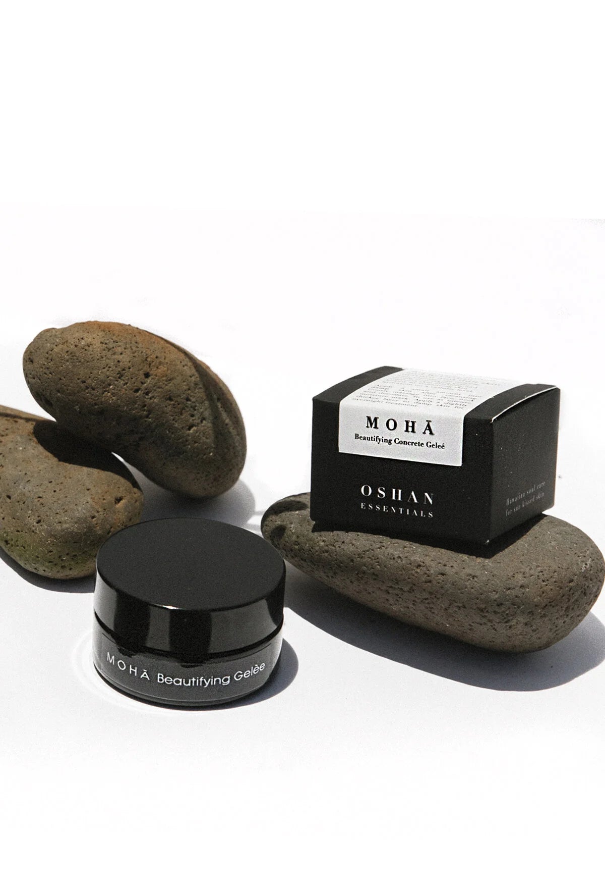OSHAN MOHĀ Beautifying Concrete Gelée jar and box balanced on stacked river stones.
