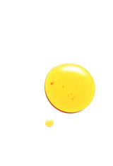 A single golden droplet of OSHAN NANI Beautifying Manoʻi oil on white.