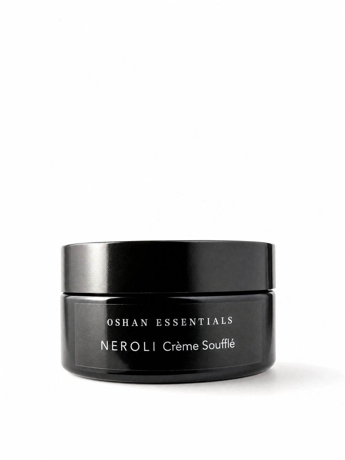 OSHAN NEROLI Crème Soufflé in its black jar on a white background.
