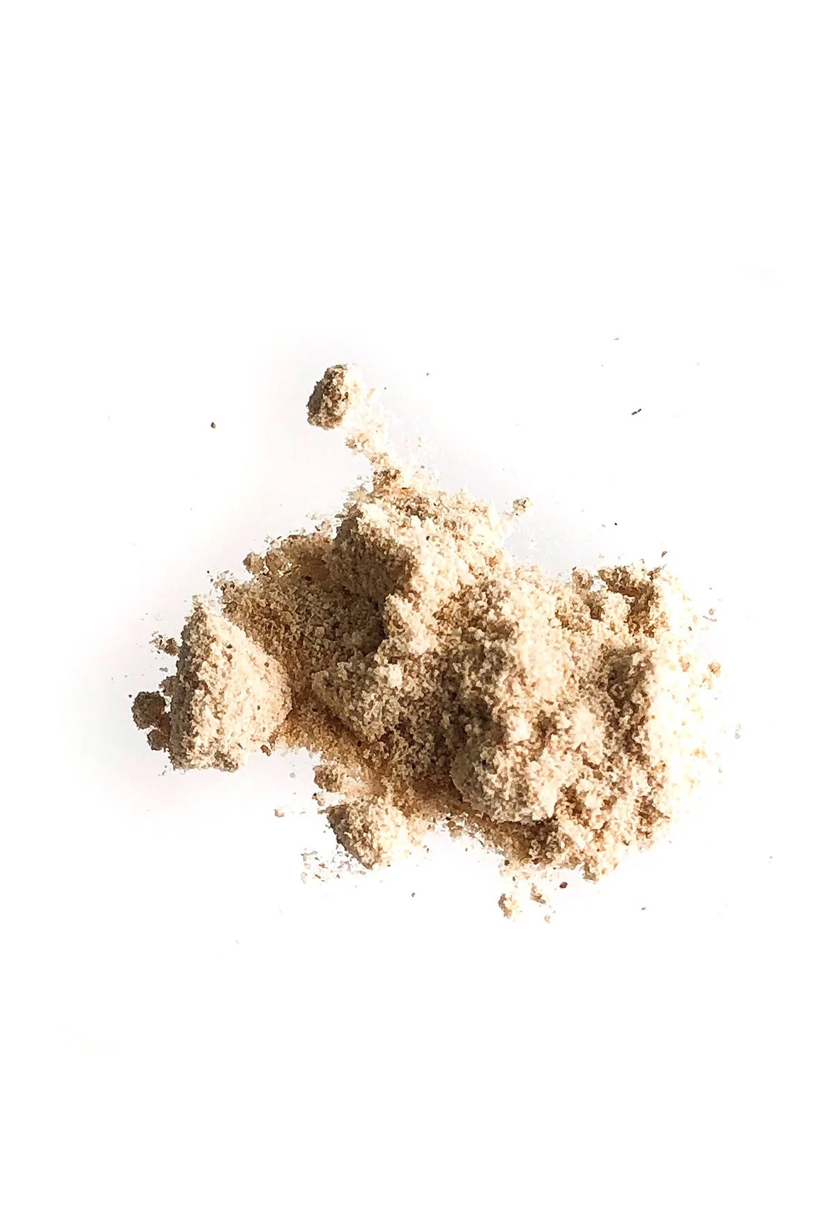Loose OSHAN NIU Cleansing Powder poured in a small heap on white.