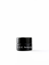 OSHAN NOE Firming Eye Cream in its small black jar on a white background.