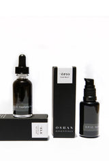OSHAN SPA Set face wash and face oil bottles standing with their boxes.