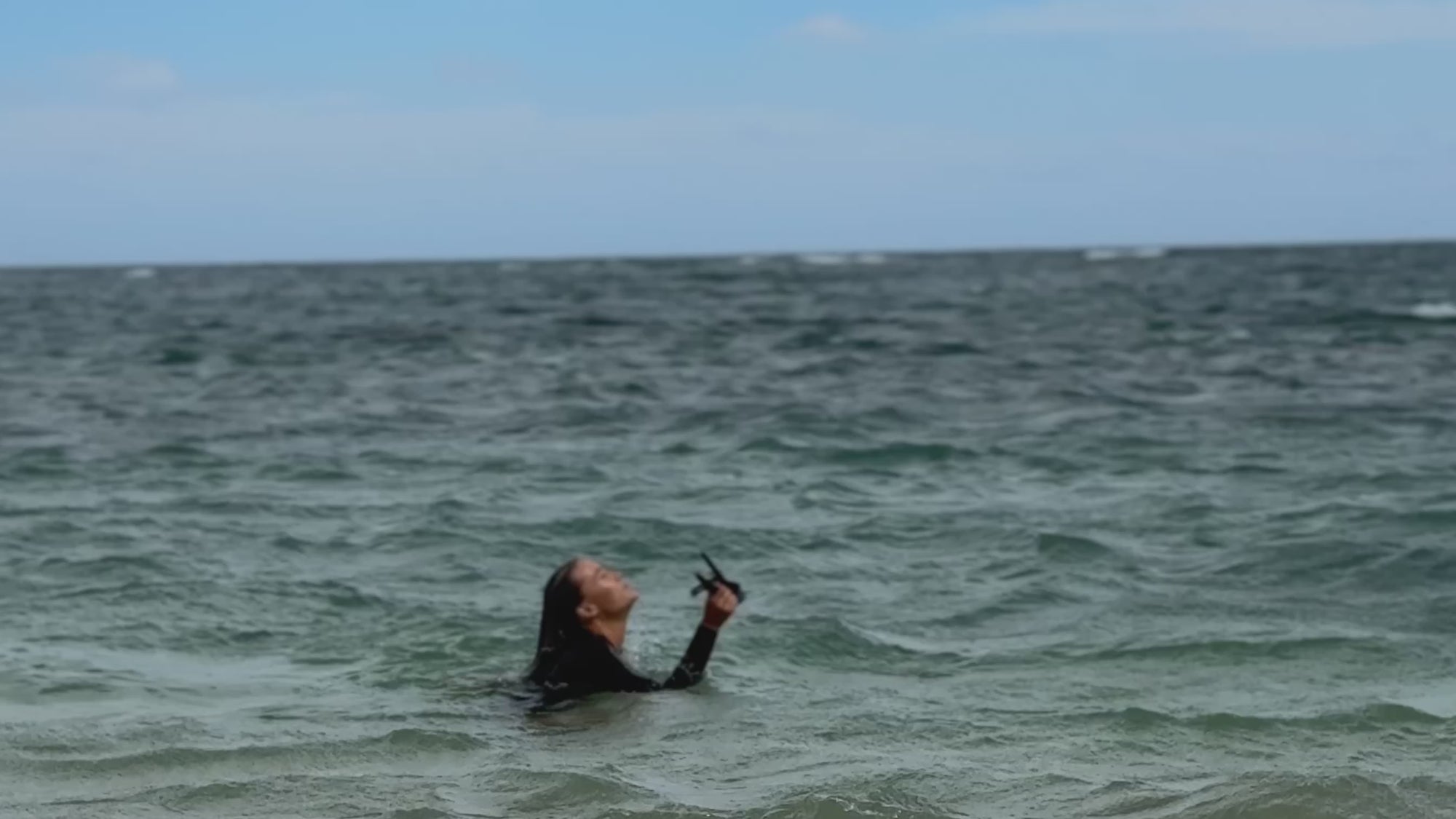 A swimmer in the ocean close to shore
